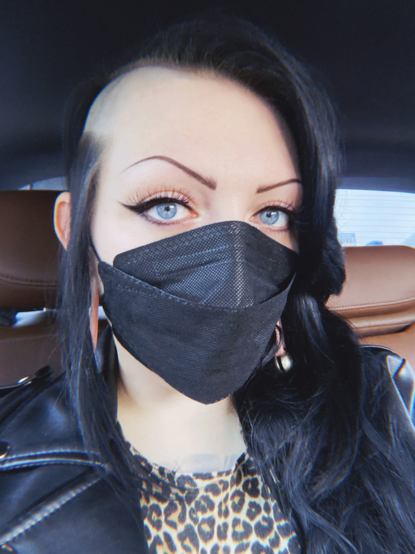 Masked vampire selfie in car